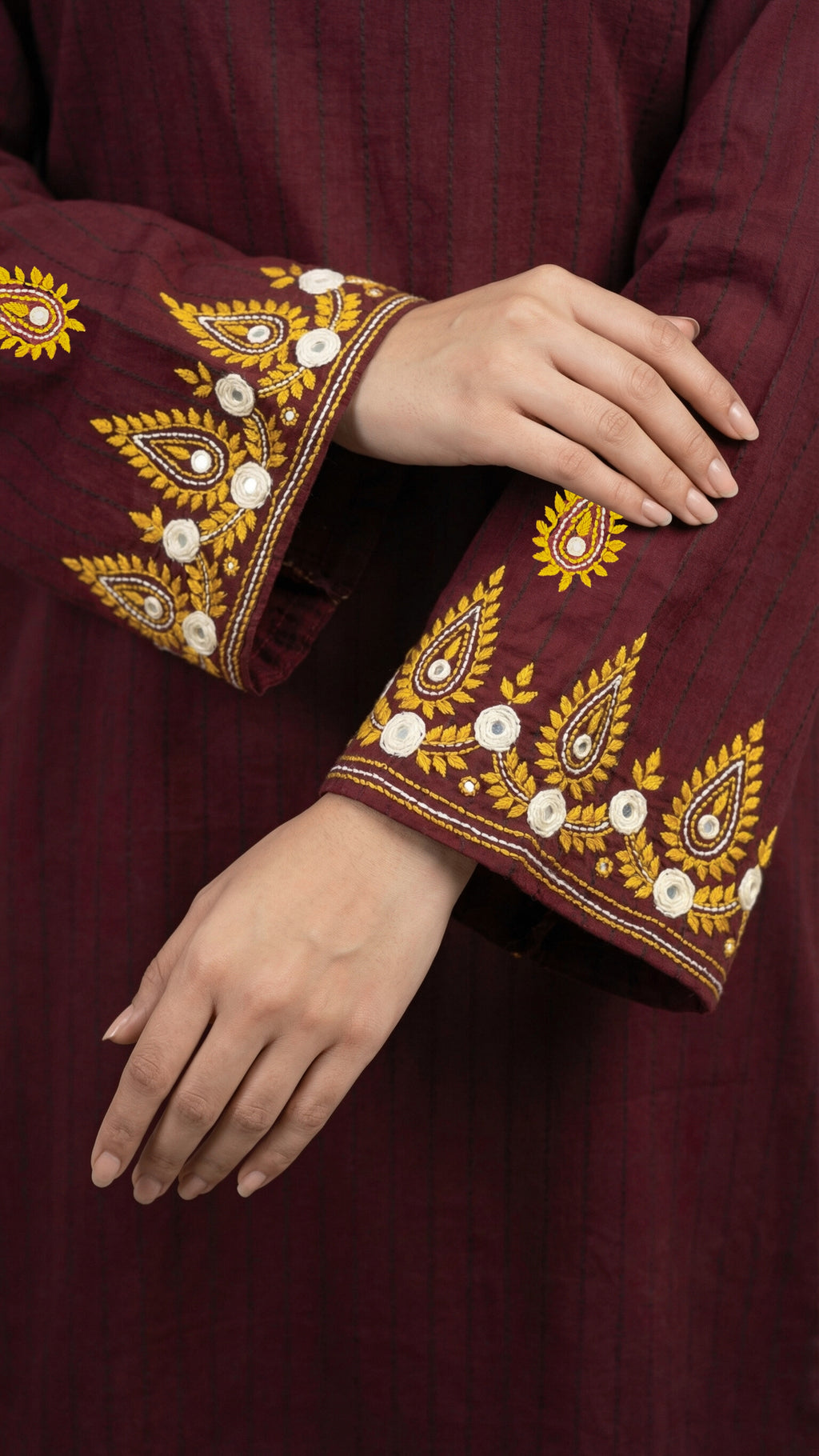 Hand embroidered sleeves and hem detail on burgundy suit

