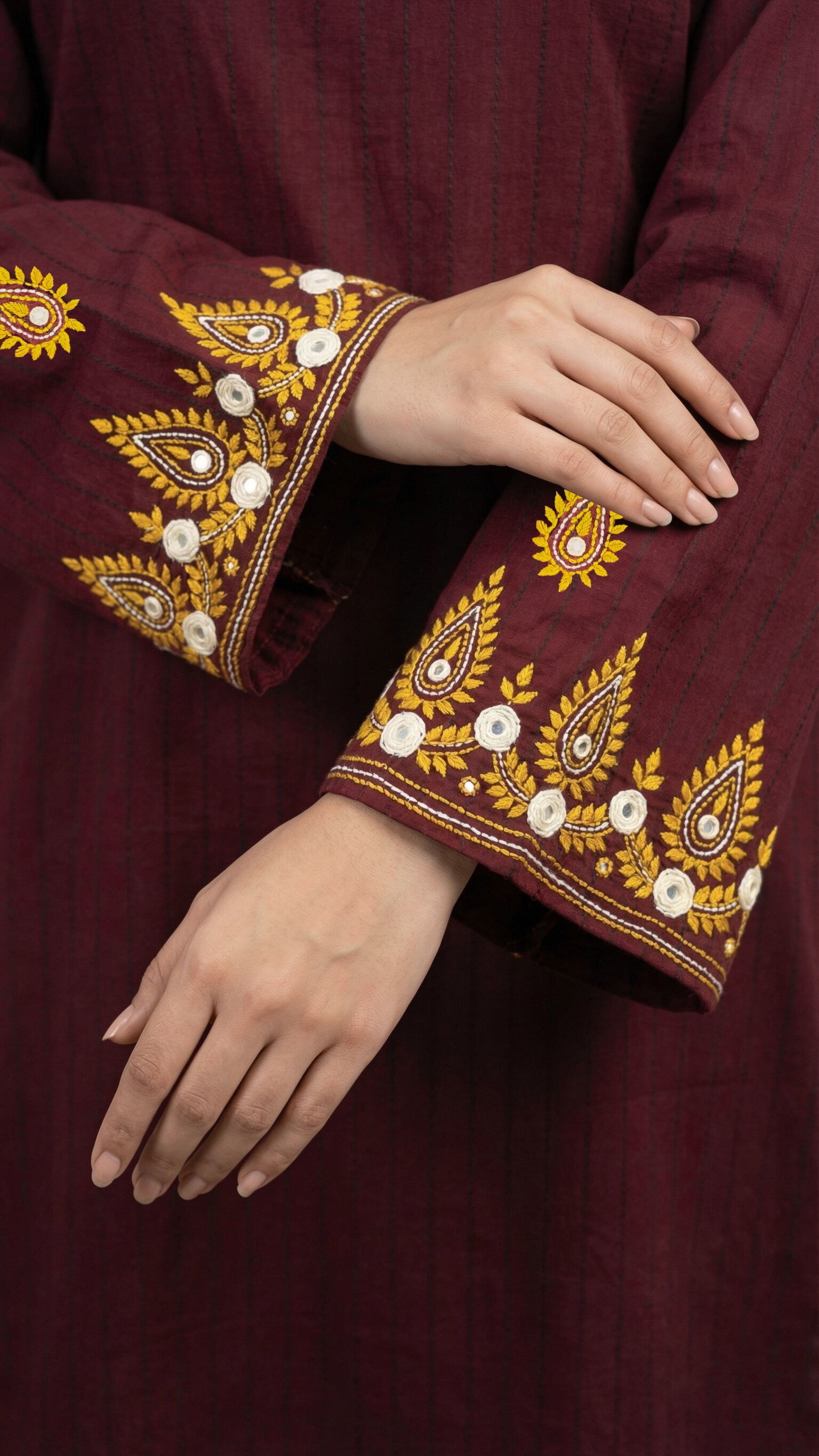 Hand embroidered sleeves and hem detail on burgundy suit

