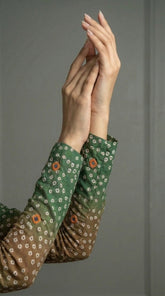 Close-up of hand embroidered silk with mirror and tila work
