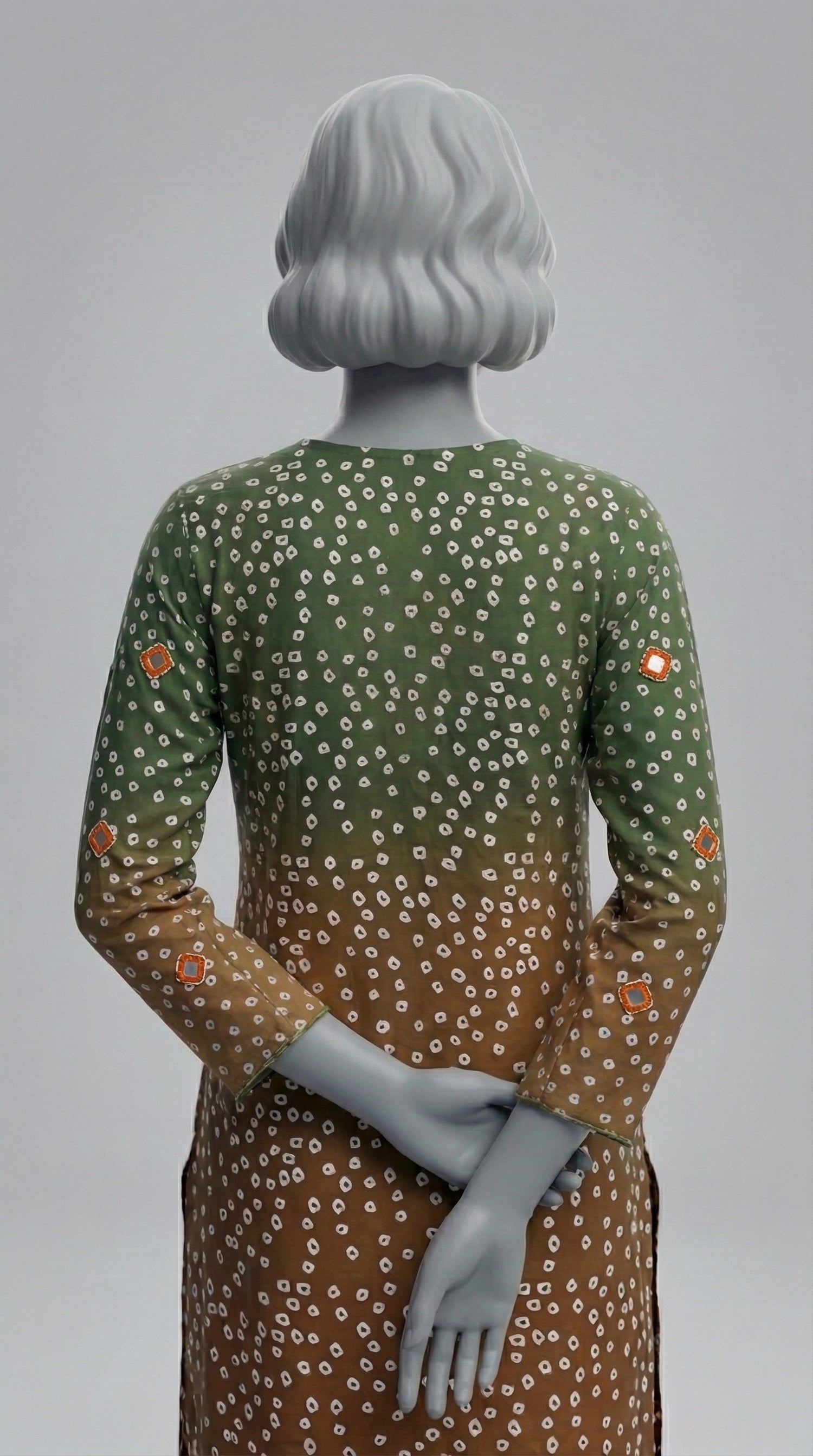 Two piece unstitched silk suit in green orange with tila embroidery

