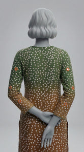 Two piece unstitched silk suit in green orange with tila embroidery
