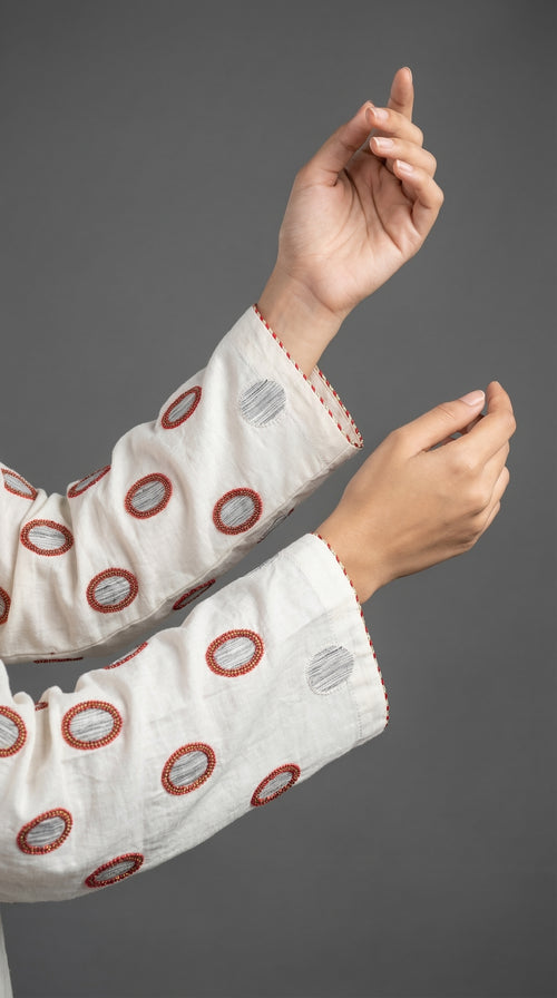  Close-up of hand embroidered Adda work with bead details on khadar

