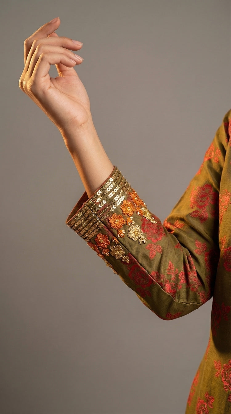  Close-up of hand embroidered Adda work on olive green crepe silk
