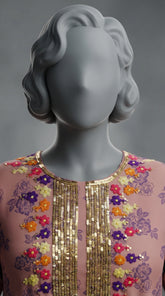  Hand embroidered neckline and hem detail on peach orange suit
