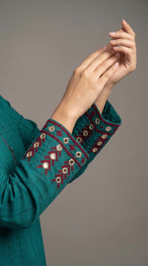 Close-up of hand embroidered Adda work with mirror details
